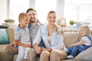 family-in-sunlit-room